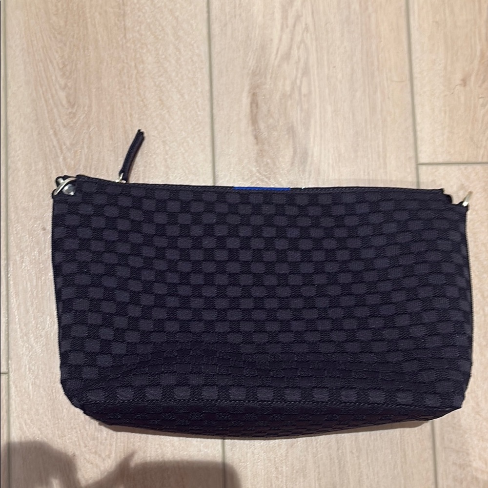 Rothy’s The Daily Crossbody in color black sand